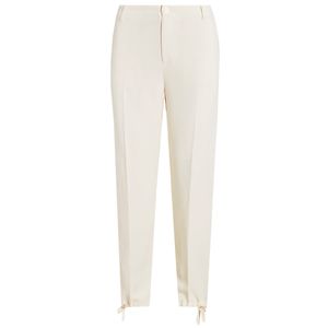 Pantaloni crema affusolati con laccetti sul fondo