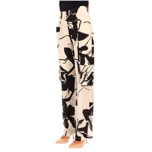 Beige and black floral silk trousers