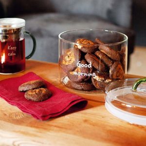 Transparent borosilicate glass jar with writing