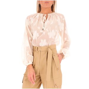 Blusa bianca con ricami floreali