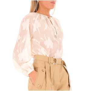 Blusa bianca con ricami floreali