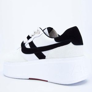 Match sneakers with maxi logoed sole