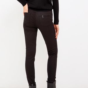 High-waisted black skinny trousers